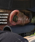 Caliber BT Wireless Shooting Ear Protection For Gun Range With Bluetooth Hearing Protection And Electronic Noise Reduction 25 dB NRR Lightweight Ear Buds For Shooters On The Go shown in use at gun range