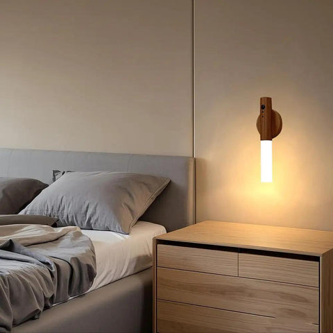 Wooden Motion Sensor Night Lights With Magnetic Body Sensor Dual Mode LED Light for hallways and stairs mounted beside bed.