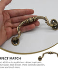 European Style Drawer Handles Set Of 10 No Drill Cupboard Pull Knobs for cabinets and dressers, shown in hand for scale