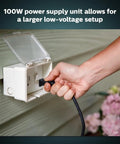 Plug And Play Outdoor 100W Power Supply For Hue Low Voltage Lights plugged into outdoor socket