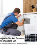 Person using Complete 722 Piece Hex Socket Bolt Nut Washer Kit for DIY cabinet repair