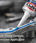 Blue High Temp RTV Gasket Maker Sealant for Valve Covers and Oil Pans, sensor safe, being applied to metallic flange.