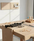 Adjustable Aluminum Dowel Jig Drill Guide Drops Dead Nuts Precision For Furniture Assembly And Cabinet Work Clamps 18 To 60mm Boards on workbench with wood scraps.