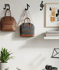 Fresh Black Cast Iron Musical Note Wall Hooks Set Of Three Decorative Coat Rack With Mounting Screws Hanging Clothes Bags And Keys In Music Room Or Kitchen Vibe with bags on hooks.