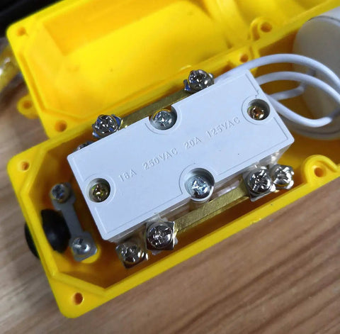 Inside view of Heavy Duty Yellow Crane Pendant Control Box With Rainproof Push Buttons For Hoist Up Down Switching, showing wiring connections.