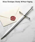 Dope Vintage Sword Letter Opener with silver finish and ergonomic grip for quick envelope opening on marble surface with envelope.