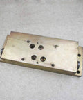 Hydraulic manifold block for waterjet intensifier, top-mount, rectangular metal with multiple ports and holes