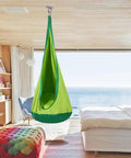 Level Up Your Daily Routine With These Rock Solid 2 Pack Wall And Ceiling Mount Brackets For Battle Ropes Gymnastic Rings Home Gym Straps And Hammocks Backing A Beefy 2800 Pound Load - green hanging hammock chair in a bright room.