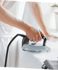 Person using Pro Grade Heavy Duty Steam Hose For Steam Iron Replacement High Temperature Hose For Professional Steam Irons