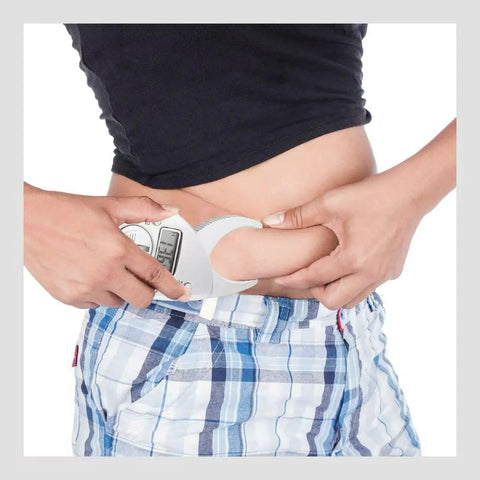 Person using Pinch And Read Digital Body Fat Caliper With LCD Display, Handheld Skinfold Fat Tester And Body Tape Measure on waist.