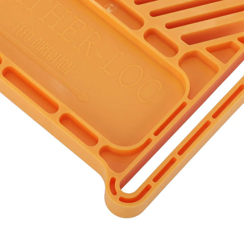 Close-up of Heavy Duty Rock Solid Woodworking Featherboard Premium Steel Adjustable Stackable Safety Clamps For Table Saw Router Table Band Saw Save Knuckles And Workshop Flow Tight showing orange plastic design with feed direction.