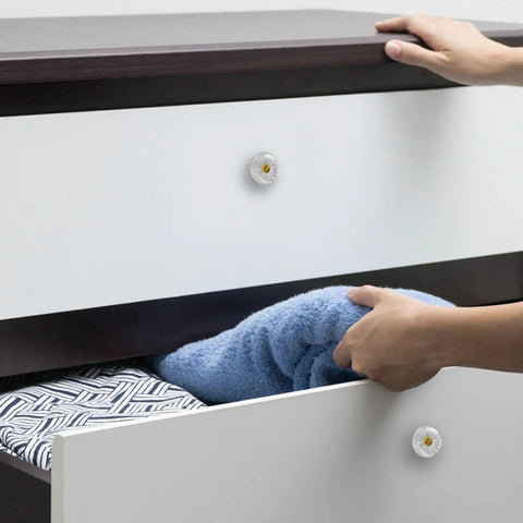White Daisy Cabinet Knobs 4 Pack 35mm Round Drawer Pulls for kitchen cabinets in use with hand opening drawer.
