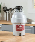 Ultra Fast Kitchen Garbage Disposal With Power Cord For No Fuss Install on wooden countertop, kitchen background visible