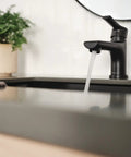 Flute Matte Black Bathroom Faucet With 0.5 GPM Flow Fits 1 Or 3 Hole 4 Inch Install Includes Base Plate And Pop Up Drain ADA Compliant