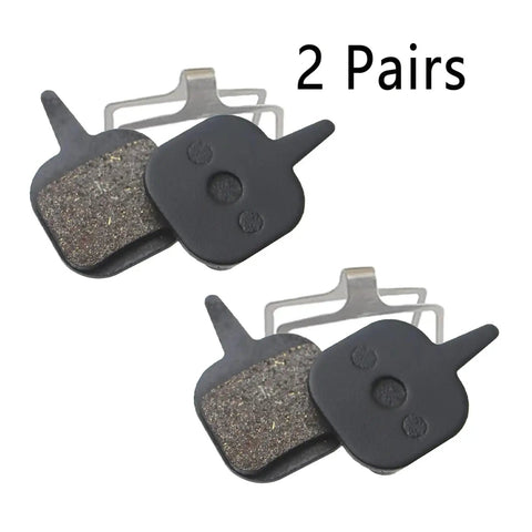 Premium Hydraulic Disc Brake Pads For Mountain And Road Bikes featuring gritty resin material, two pairs for enhanced braking power.