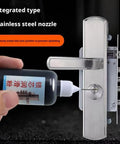 Hand applying lubricant with nozzle onto a stainless steel door lock for Graphite Lock Lubricant Powder For Car Keys And Door Locks Universal Hinge And Window Guide Lubricant Multifunctional Lock Powder For Smooth Operation Rust Prevention And Easy Key Insertion 1 Piece