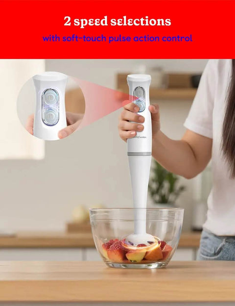 Slick Two Speed Hand Blender With Beast Mode 300W Peak Motor in use mixing fruits in a bowl, showcasing soft touch pulse control.