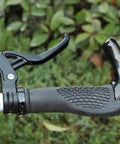 Close-up of Dual Pack 4-Finger Anti-Skid Bicycle Brake Levers for 22mm Handlebars Aluminum Alloy on a bike handle.