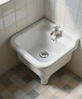 No Fuss Solid Stainless Steel Bathtub Drain Strainer And Hair Catcher Filter Basket For Bathroom Sink Drain Plug Built Like A Tank To Kill Clogs Zero Hassle Total Lifesaver For Your Tub Or Washbasin Pack Of Two in a white basin with faucet.