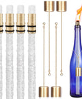 Wine Bottle Torch Kit With Long Life Wicks And Brass Wick Holders For DIY Outdoor Tiki Torches Just Add Any Bottle To Create Warm Garden Light And Bar Decor Pack Of 4, showing fiberglass wicks and brass caps next to a lit blue bottle torch