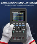 Hands holding Portable 2 Channel 70MHz Oscilloscope With Built In Waveform Generator And Multimeter, screen displaying graph.