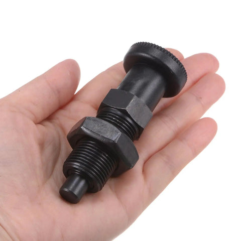 Heavy Duty Push Fit Ball Nose Spring Plunger With M20x1.5 Thread And 1.3 Inch Length held in hand, showcasing durable black carbon steel.