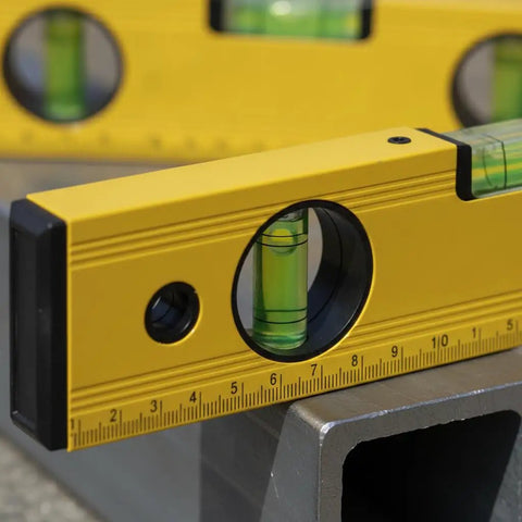 Spirit Level, Aluminum Alloy, 250mm close-up showing bubble level and measurement markings on a work surface.