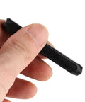 Hand holding a carbon steel stamp from Pro Grade Metal Stamping Kit With Carbon Steel Stamps 3mm Alphabet And Number Punches Hard Case Leather