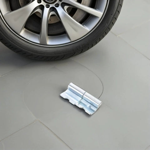 Heavy Duty Left Side Truck Cargo Box Panel Hinges two sets placed near a car tire on a gray surface.