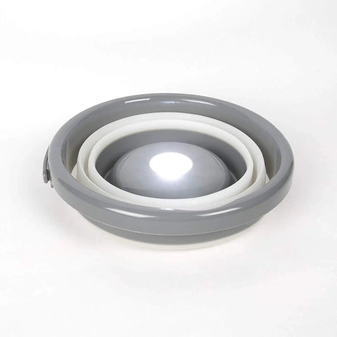 5 Liter Collapsible Flashlight Bucket With 200 Lumen Removable Magnetic Puck Light, folded view, white and gray material.
