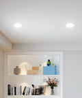 Ceiling view of 16 Pack 4 Inch Ultra Thin LED Recessed Ceiling Light With Junction Box 5 CCT Selectable 2700K 3000K 4000K 5000K 6000K Dimmable 11W 800 Lumen Output Equivalent To 70W ETL Listed Easy Install illuminating a modern living room