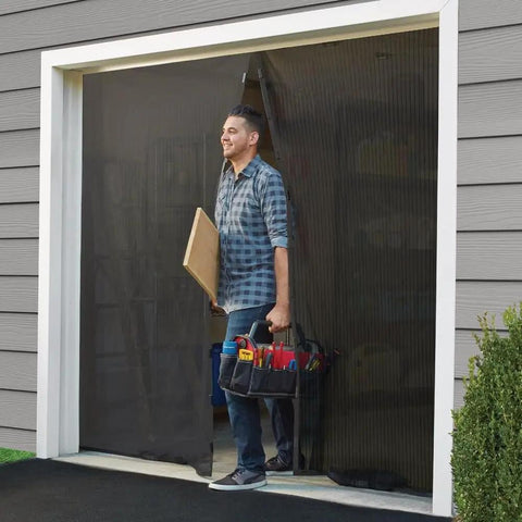 Man walking through hands free magnetic door screen for double doors keeps bugs out and fresh air in easy install mosquito net