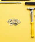 Lawn Aerator Shoes Spikes 5.8cm Steel Replacement Spikes For Manual Gardening, 20 Pack on yellow background, surrounded by tools.