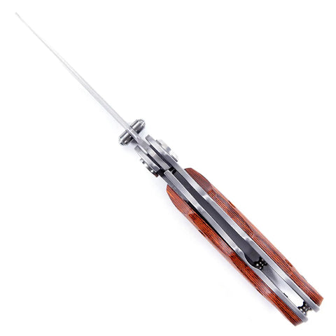 Top view of Framelock Folding Knife Kit FLX25 With Cocobolo Dymondwood Handles, blade and thumb stud visible.