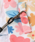 Close-up of floral fabric and clip of the Anti Pinch Design Bird Flight Suit For Parrots Adjustable Walking Harness And Training Gear