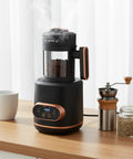 Electric Coffee Bean Roaster Machine For Home Kitchen Using 1500W Motor And Quick Heat Function, with coffee beans and grinder.