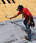 Top Tier Roofing Underlayment Delivers Ultra Lightweight Coverage In 48 Inch Wide By 250 Foot Rolls For Lightning Fast Deck Prep And Bulletproof Weather Blocking being installed by a worker.