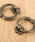 Two zinc alloy antique bronze drawer handles on wood surface for jewelry boxes and DIY projects, easy install with screws.