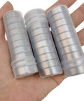 Hand holding 24 pack rubber sealed ball bearings in plastic tubes