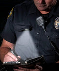 Police officer using White LITE Hands Free LED Pocket Light With USB Rechargeable Power, clip-on uniform, nighttime writing