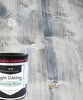 Top Tier Light Oak Reactive Water Based Wood Stain Zero VOC Heavy Duty 55 Gallon Drum shown on a light wooden surface.