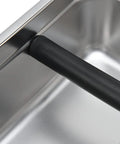 Close-up of the Boss Move Stainless Steel Coffee Knock Box For Espresso Pro Barista Gear showing the rubber handle detail.