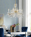 Modern Crystal Chandelier Light Fixture With Six Lights, Raindrop Pendant Crystals In Maria Theresa Brass Finish, D20 X H18 Inches over dining table