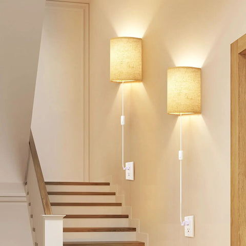 Plug In Wall Sconces Set Of Two With Three Adjustable Color Temperatures And Built In Switch For Hassle Free Plug And Play Lighting That Brings Solid Vibes To Your Space, beige fabric shades on wall.