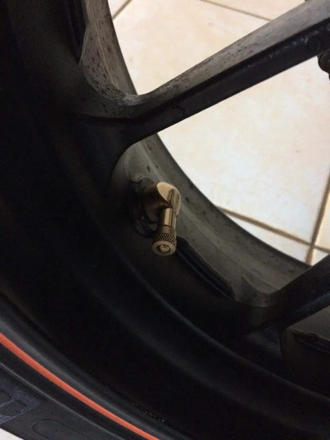 Installed Angled Valve Stem Set With Pre Applied Threadlocker Nut Forged Aluminum Construction 0.357 Inch Blue Finish