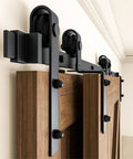 DIY Ready Sliding Barn Door Hardware Kit With Black Steel Rollers for Interior Double Doors, 9 Ft Rail, Installed on Wood