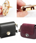 GeoGeoDIY turn lock purse clasps set with washers; gold-tone hardware shown on black and burgundy handbags.