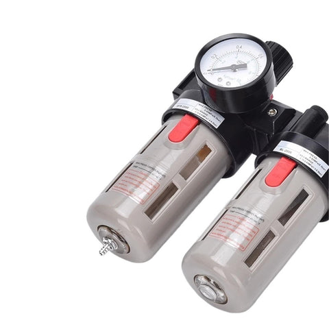 Close-up of oil water separator filter regulator FRL combination for air compressors with dual transparent canisters and gauge