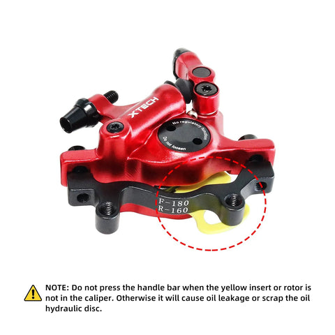 Red aluminum alloy hydraulic disc brake caliper with mounting adapter; shows F-180 and R-160 rotor sizes.