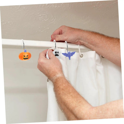 Person hanging Halloween Shower Curtain Hooks Bat Pumpkin Ghost Design 12 Piece Set With Smooth Glide No Snag Metal Rings